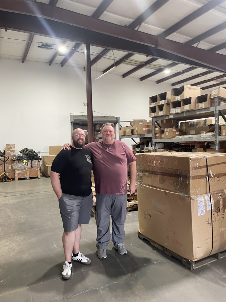 Maurice (left) and Miles Huffman inside the new warehouse headquarters for their Swiss Link military surplus business, now based out of Chico. (Photo by Jason Cassidy)